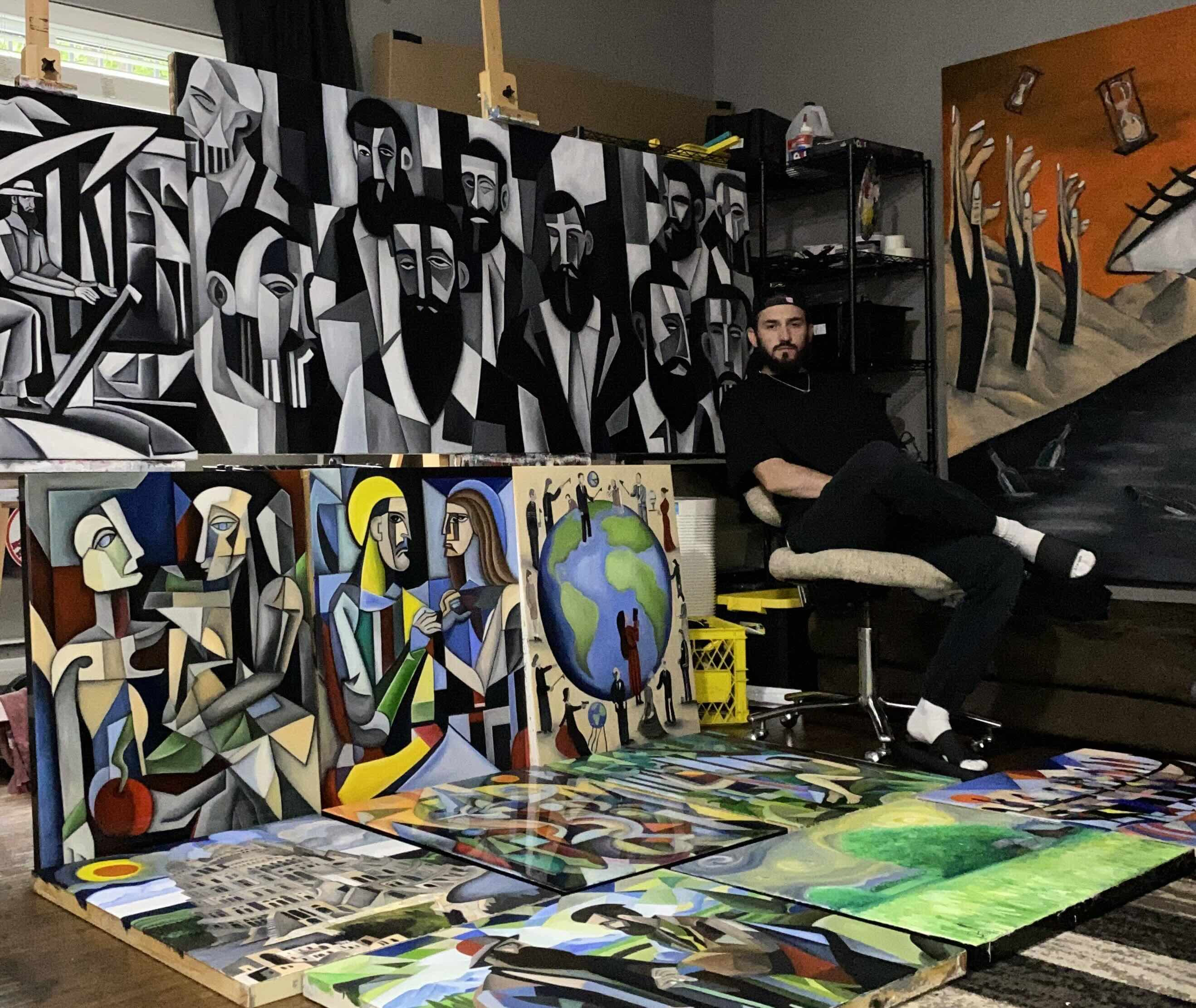 Photograph of Canadian Artist Luke Edward Stripp in studio with his 'Genesis' Collection